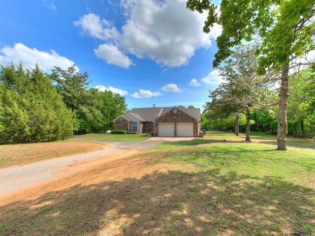 16900 SE 59th St, Choctaw, OK 73020 - view of front of home with driveway, an attached garage, and a front yard