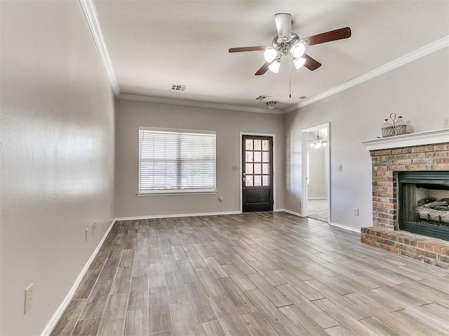 unfurnished living room featuring baseboards, ceiling fan, ornamental molding, and wood finished floors