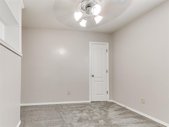 unfurnished room featuring ceiling fan, visible vents, baseboards, and carpet