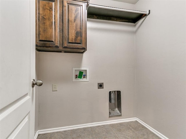 laundry area featuring cabinet space, electric dryer hookup, baseboards, and washer hookup