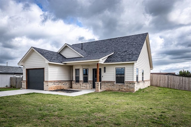 view of front of property with driveway, a garage, fence, and brick siding