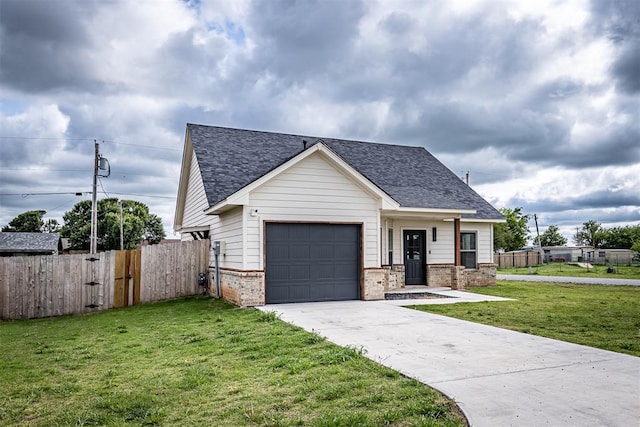 view of front of house featuring a garage, fence, and roof with shingles