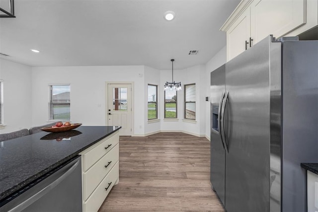 kitchen with recessed lighting, a chandelier, visible vents, appliances with stainless steel finishes, and wood finished floors