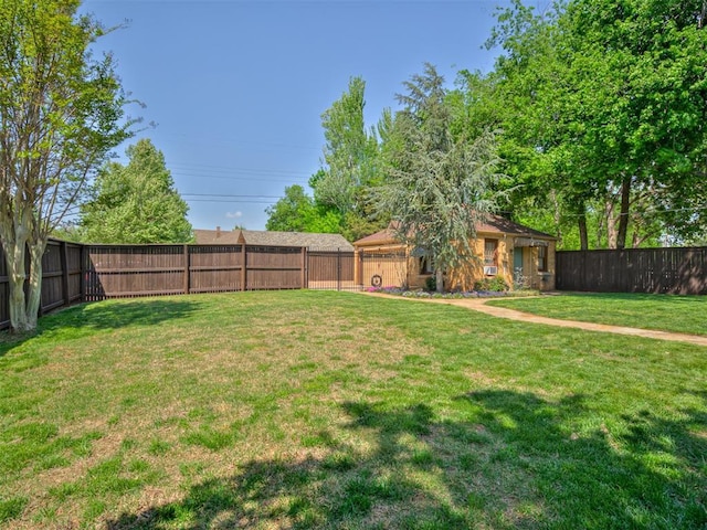 view of yard with a fenced backyard