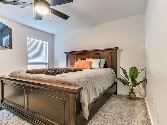 bedroom featuring baseboards, ceiling fan, and carpet