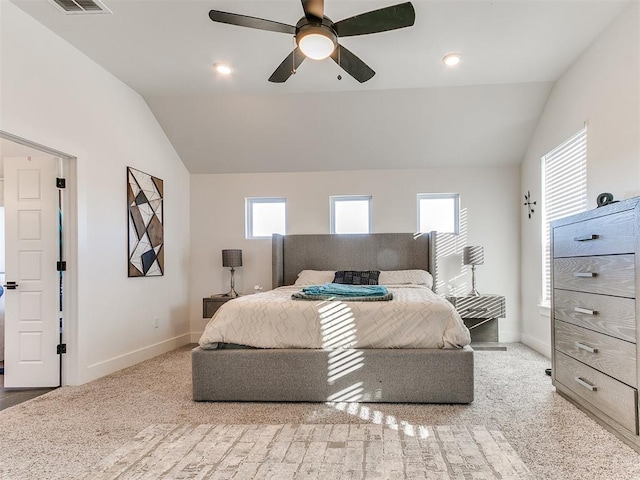 carpeted bedroom with baseboards, ceiling fan, vaulted ceiling, and visible vents