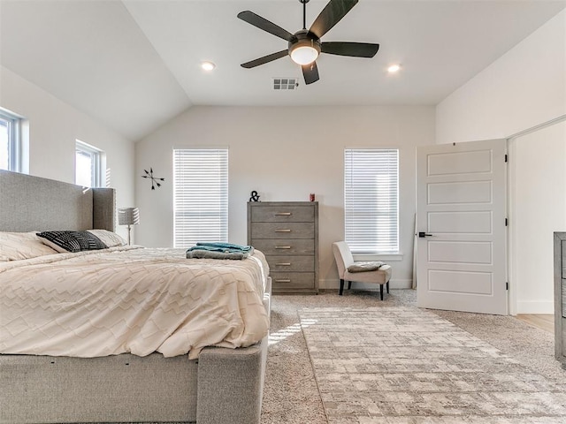 bedroom with visible vents, light carpet, baseboards, a ceiling fan, and vaulted ceiling
