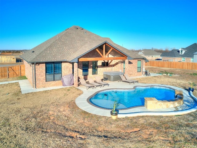 view of pool with a fenced backyard, a fenced in pool, a jacuzzi, and a patio area
