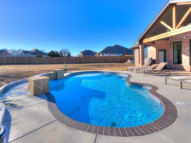 view of pool with a fenced in pool, a fenced backyard, and a patio area