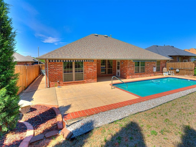 view of pool with a fenced backyard, a fenced in pool, and a patio