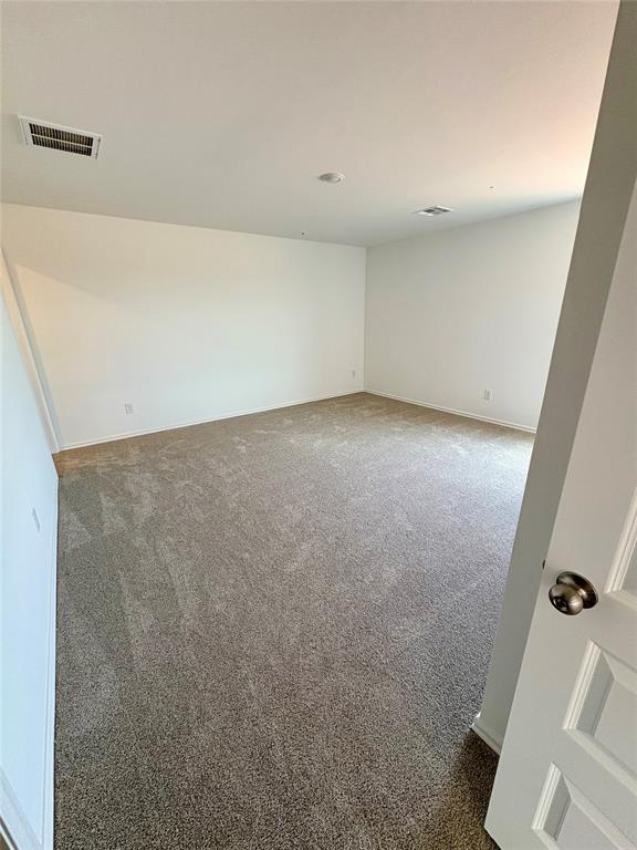424 Kale Rd, Tuttle, OK 73089 - carpeted spare room featuring baseboards