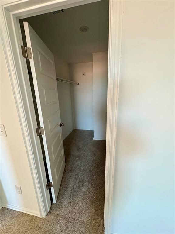 424 Kale Rd, Tuttle, OK 73089 - hallway featuring carpet floors and baseboards