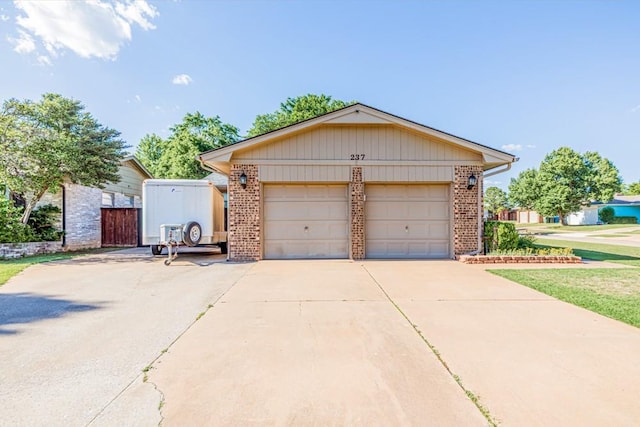 237 E 30th St, Edmond, OK 73013 - view of front of home with brick siding and a garage