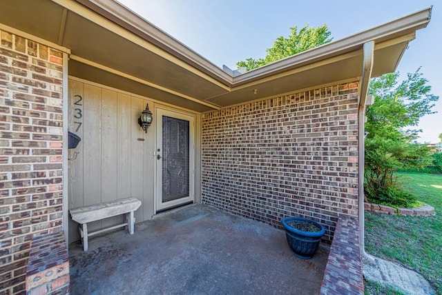 237 E 30th St, Edmond, OK 73013 - property entrance with brick siding and a patio