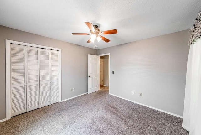 237 E 30th St, Edmond, OK 73013 - unfurnished bedroom featuring carpet flooring, baseboards, a closet, and ceiling fan