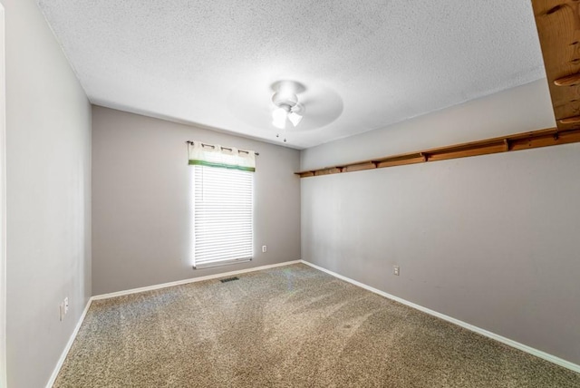 237 E 30th St, Edmond, OK 73013 - carpeted spare room with a ceiling fan, baseboards, and a textured ceiling