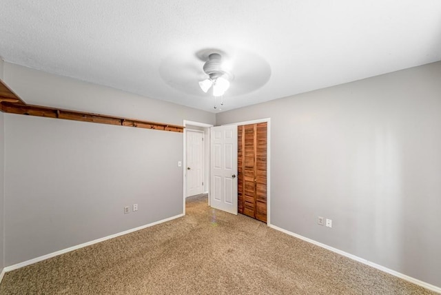 237 E 30th St, Edmond, OK 73013 - unfurnished bedroom with a closet, carpet, baseboards, and ceiling fan