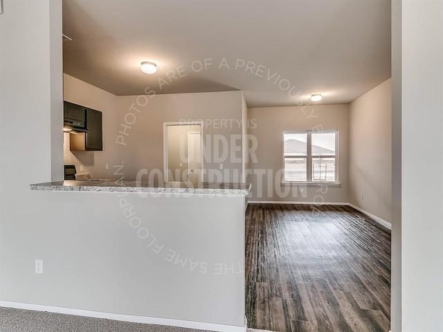 3813 S Ravine St, Stillwater, OK 74074 - interior space featuring baseboards and dark wood-style flooring