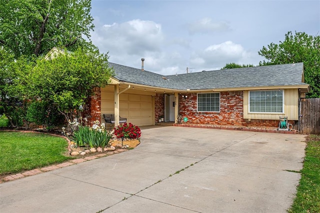 ranch-style house featuring fence, roof with shingles, an attached garage, brick siding, and concrete driveway