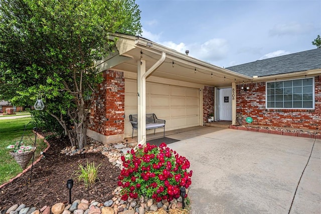 view of front of house with brick siding, an attached garage, driveway, and a shingled roof