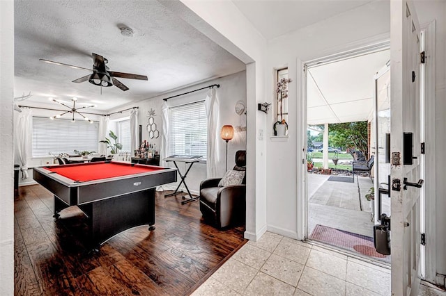 rec room featuring baseboards, ceiling fan, billiards, and a wealth of natural light