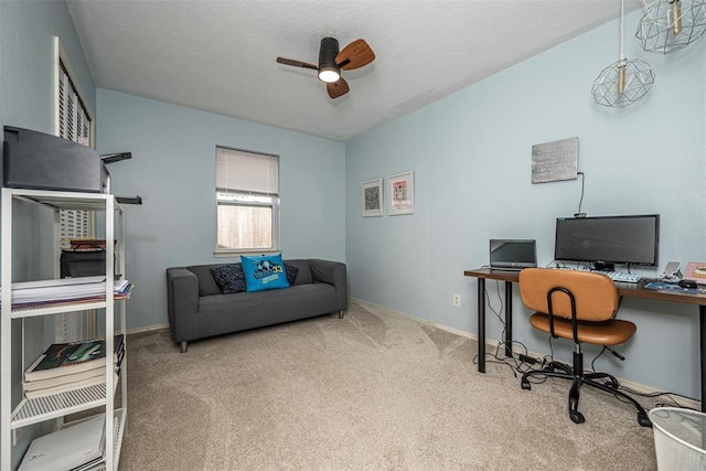 home office featuring carpet floors, baseboards, and ceiling fan