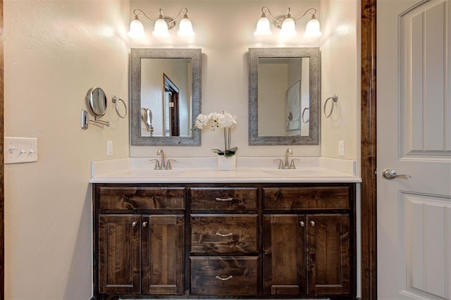 bathroom featuring double vanity and a sink
