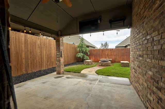 view of patio / terrace with fence and ceiling fan