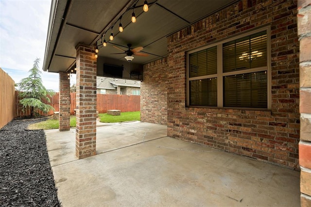 view of patio featuring a fenced backyard and a ceiling fan