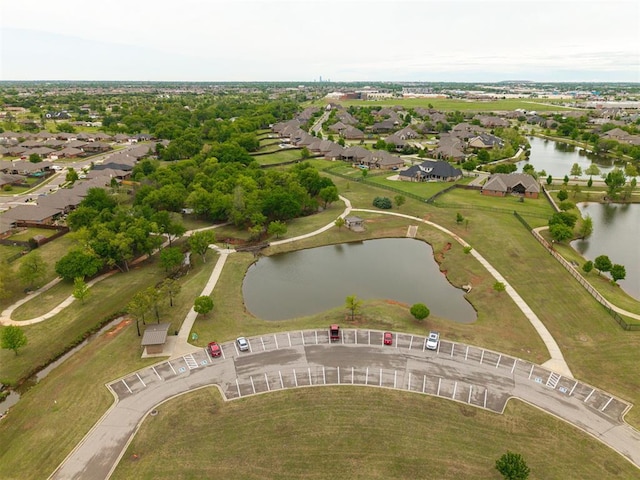 birds eye view of property with a residential view and a water view