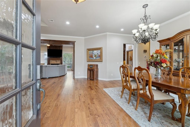532 Conquistador Ct, Edmond, OK 73025 - dining space with recessed lighting, light wood-style floors, baseboards, visible vents, and a notable chandelier