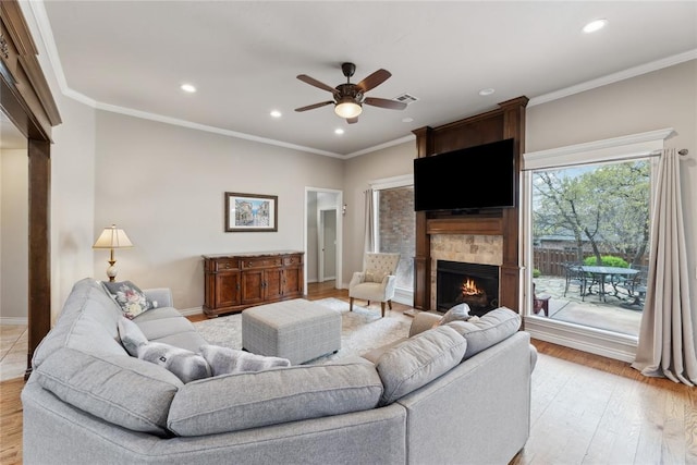 532 Conquistador Ct, Edmond, OK 73025 - living area featuring recessed lighting, a ceiling fan, light wood finished floors, and a fireplace