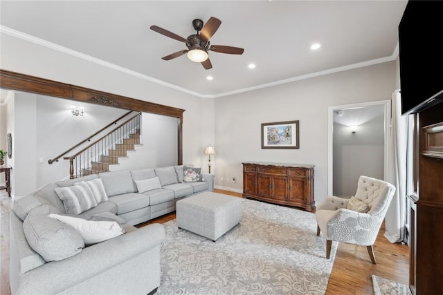532 Conquistador Ct, Edmond, OK 73025 - living area with recessed lighting, ceiling fan, stairs, ornamental molding, and wood finished floors