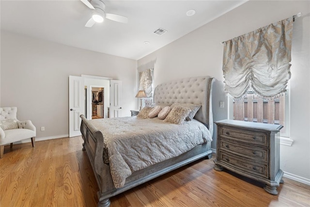 532 Conquistador Ct, Edmond, OK 73025 - bedroom with light wood finished floors, visible vents, baseboards, and a spacious closet