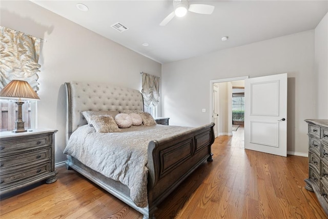 532 Conquistador Ct, Edmond, OK 73025 - bedroom with a ceiling fan, visible vents, light wood-style flooring, and baseboards