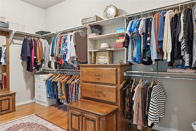 532 Conquistador Ct, Edmond, OK 73025 - walk in closet with wood finished floors