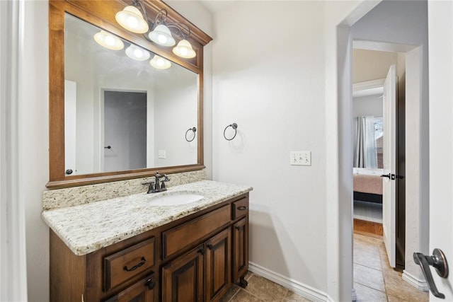 532 Conquistador Ct, Edmond, OK 73025 - bathroom with vanity, tile patterned flooring, and baseboards