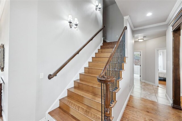 532 Conquistador Ct, Edmond, OK 73025 - stairs featuring baseboards, ornamental molding, and wood finished floors