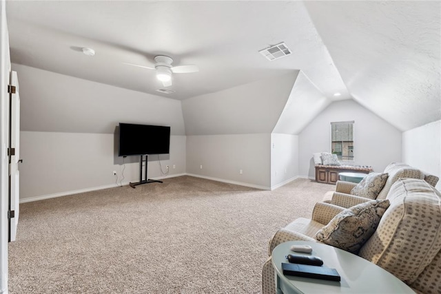 532 Conquistador Ct, Edmond, OK 73025 - living room featuring visible vents, light carpet, vaulted ceiling, and baseboards