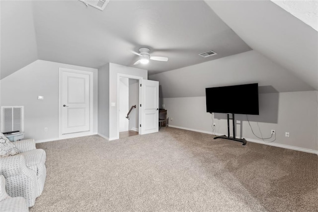 532 Conquistador Ct, Edmond, OK 73025 - interior space featuring visible vents, ceiling fan, carpet, and lofted ceiling