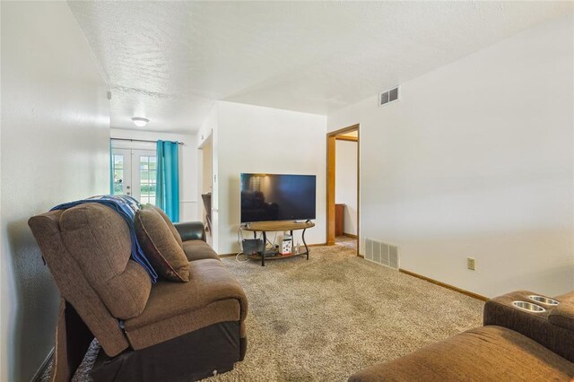 1305 Juniper Cir, Oklahoma City, OK 73110 - living room featuring visible vents, baseboards, carpet floors, and french doors