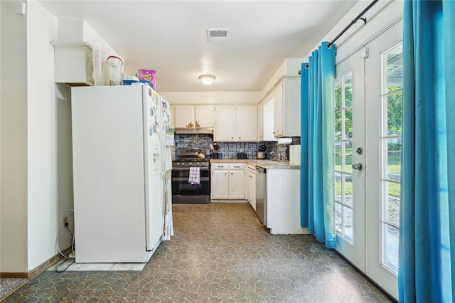 1305 Juniper Cir, Oklahoma City, OK 73110 - kitchen featuring visible vents, decorative backsplash, appliances with stainless steel finishes, and a healthy amount of sunlight