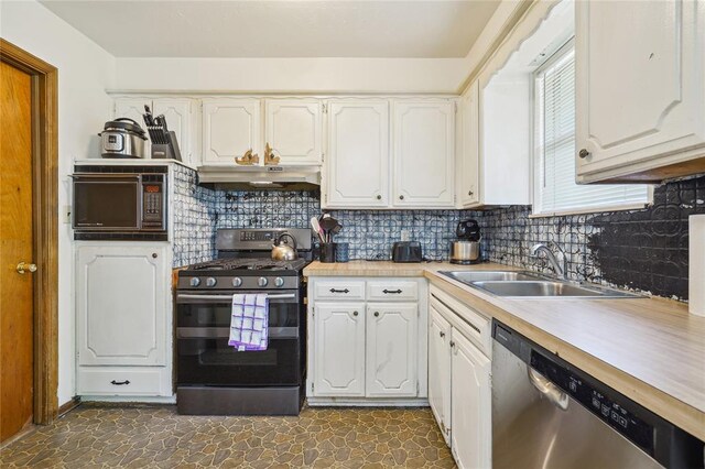 1305 Juniper Cir, Oklahoma City, OK 73110 - kitchen featuring light countertops, white cabinetry, under cabinet range hood, a sink, and stainless steel appliances
