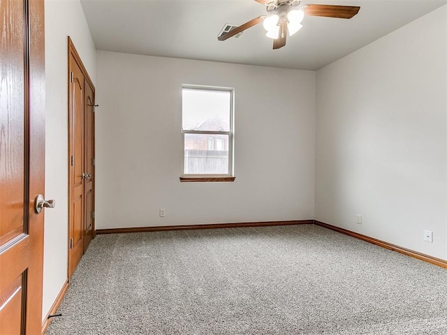 unfurnished bedroom with carpet floors, a ceiling fan, baseboards, and a closet