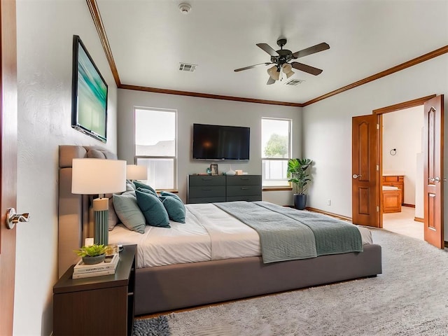 bedroom featuring crown molding, visible vents, and ensuite bath
