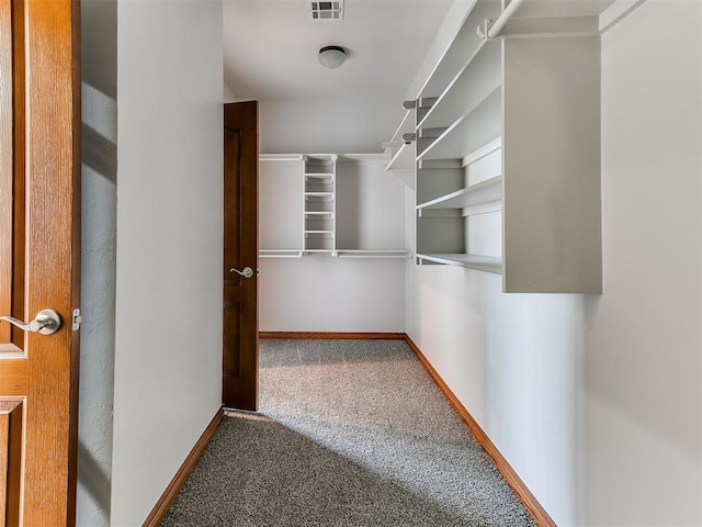 walk in closet with carpet floors and visible vents