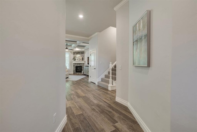 hallway featuring stairs, beamed ceiling, baseboards, dark wood-type flooring, and coffered ceiling