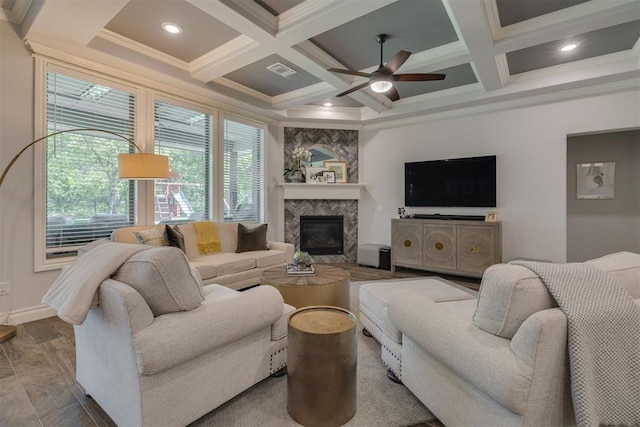 living room featuring crown molding, ceiling fan, beam ceiling, visible vents, and coffered ceiling