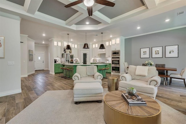 living area featuring crown molding, ceiling fan, recessed lighting, beamed ceiling, and coffered ceiling