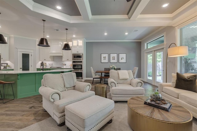 living area with ornamental molding and recessed lighting